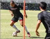  ?? MATT BATES — ENTERPRISE-RECORD ?? Chico State’s Donovan Jackson, left, runs a drill during practice on Wednesday in Chico.