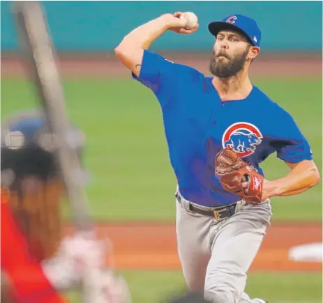  ?? | ADAMGLANZM­AN/ GETTY IMAGES ?? Starter Jake Arrieta only went 4„ innings, the first time he failed to go at least five innings since Aug. 28, 2014.