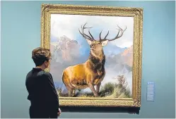  ?? Picture: Angus Findlay. ?? A visitor admires the painting.