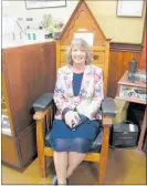  ??  ?? Mayor Tracey Collis arrived late but took the chance to try out the old Mayoral Chair.