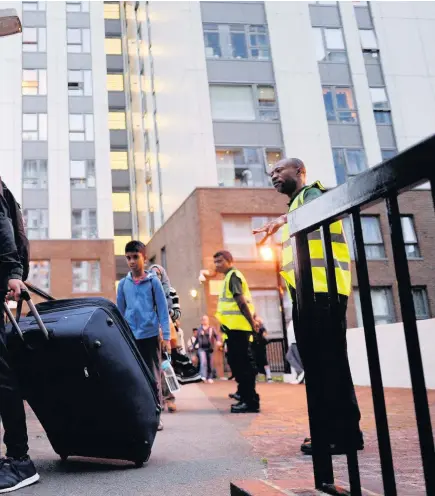  ?? STEFAN ROUSSEAU ?? the building is evacuated in the wake of the Grenfell Tower fire for ‘urgent fire safety works’