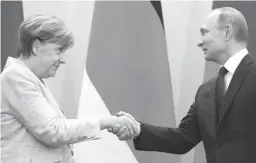  ?? Associated Press ?? Russian President Vladimir Putin, right, shakes hands with German Chancellor Angela Merkel on Tuesday after their talks at Putin’s residence in the Russian Black Sea resort of Sochi, Russia. German Chancellor Angela Merkel has arrived in Russia for...