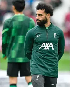  ?? Photo — AFP file ?? Salah warms up ahead of the English Premier League match between West Ham United and Liverpool at the London Stadium, in London.