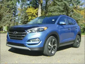  ?? Herald photos by Al Beeber ?? The Hyundai Tucson, above and below left, is a stylish compact crossover