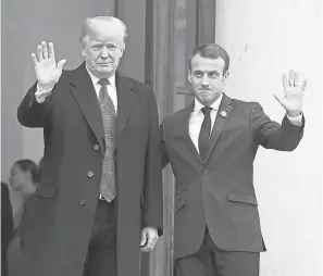  ?? LUDOVIC MARIN/AFP/GETTY IMAGES ?? President Donald Trump’s meeting Saturday with French President Emmanuel Macron lacked the warmth of previous encounters.