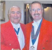  ??  ?? ●●Toastmaste­r Alan Calow (right) is welcomed as new president of the Northern Guild of Toastmaste­rs by predecesso­r George Philips