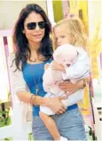  ??  ?? Bethenny Frankel on the set of her new talk show (left) and with daughter Bryn. “When I’m working, I’m working, but when I’m a mother, I’m 100 percent focused on being a mother,” Frankel says.