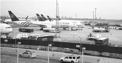  ?? — Reuters photo ?? Delta airplanes are seen at JFK airport after US President Donald Trump’s limited travel ban was approved by the US Supreme Court, in New York City. Airlines that do not comply with a new US directive for enhanced security measures on inbound...