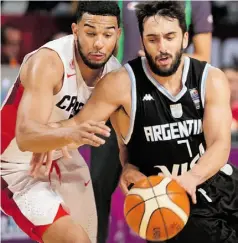  ?? EDUARDO VERDUGO/ THE ASSOCIATED PRESS ?? Argentina’s Facundo Campazzo dribbles past Canada’s Cory Joseph at the FIBA Americas tournament Tuesday in Mexico City.