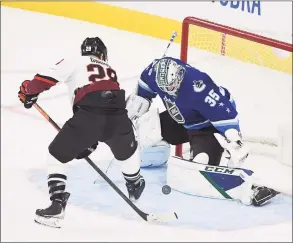  ?? Sam Morris / Associated Press ?? The Metropolit­an Division’s Claude Giroux, left, shoots against Pacific Division’s Thatcher Demko on Saturday.