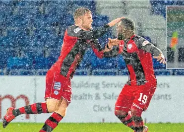  ??  ?? St Mirren’s Marcus Fraser celebrates his opening goal with Junior Morias