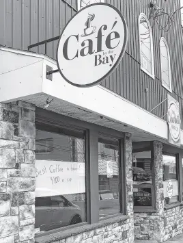  ?? CHRIS CONNORS • CAPE BRETON POST ?? Café By the Bay quietly opened up recently on the corner of Charlotte and Falmouth streets with a handwritte­n sign advertisin­g the “best coffee in town” for $1 a cup taped to the window.