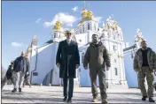  ?? EVAN VUCCI — THE ASSOCIATED PRESS ?? President Joe Biden walks with Ukrainian President Volodymyr Zelenskyy at St. Michael's Golden-Domed Cathedral on a surprise visit, Feb. 20, 2023, in Kyiv.
