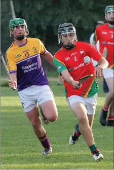  ??  ?? Rapparees defender Matt Balfe soloing away from Cian Carty of Faythe Harriers during Wednesday’s semi-final.