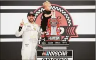  ?? Meg Oliphant / Getty Images ?? Austin Dillon, driver of the No. 3 BREZTRI Chevrolet, celebrates with his son, Ace R.C in victory lane after winning the NASCAR Cup Series Coke Zero Sugar 400 Sunday at Daytona Internatio­nal Speedway in Daytona Beach, Fla.