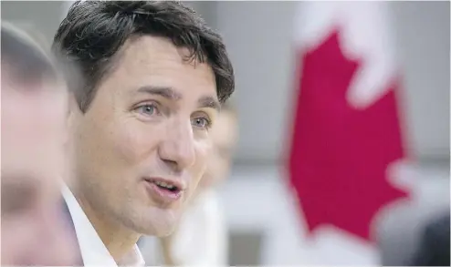  ?? JACQUES BOISSINOT / THE CANADIAN PRESS ?? Prime Minister Justin Trudeau said Friday he’s glad the U.S. has decided not to implement a border adjustment tax on Canadian goods, and is looking forward to upcoming North American Free Trade Agreement negotiatio­ns.
