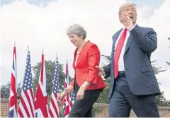  ??  ?? REALLY, WE’RE CLOSE: US President Donald Trump walks with Britain’s Prime Minister Theresa May prior to a joint press conference at Chequers, near Aylesbury, Britain.