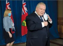  ?? CP PHOTO FRANK GUNN ?? Ontario Premier Doug Ford and Health Minister Christine Elliott arrive at Queen’s Park in Toronto on Tuesday.