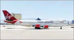  ?? ETHAN MILLER/GETTY/AFP ?? A Virgin Atlantic Airways 747-400 aircraft in Las Vegas in 2010. Virgin has said it will no longer buy carbon offsets from a Cambodia-based project that has been deemed a failure.