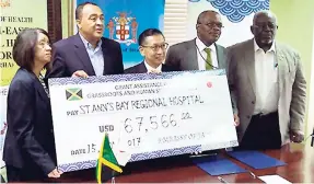  ?? PHOTO BY PAUL CLARKE ?? Minister of Health Dr Christophe­r Tufton (second left); Japanese Ambassador to Jamaica Hiromasa Yamazaki (third left); Sancia Bennett Templer (left), permanent secretary in the Ministry of Health; Leo Garel (second right), chief executive officer, St...