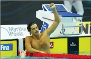  ?? PETR DAVID JOSEK — THE ASSOCIATED PRESS ?? Thomas Ceccon of Italy celebrates after winning the Men 100m Backstroke final string a new world record at the FINA World Championsh­ips in Budapest, Hungary, Monday.