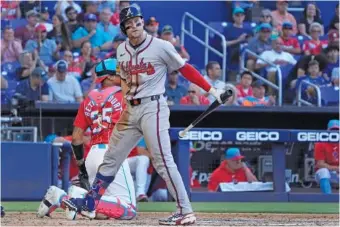  ?? AP PHOTO/WILFREDO LEE ?? The Atlanta Braves’ Jarred Kelenic reacts after striking out swinging during the fifth inning of Saturday’s game against the host Miami Marlins.