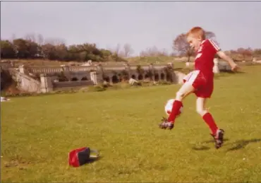  ??  ?? May, 1990: Dean Goodison enjoying a kickabout with his father, Michael, in Crystal Palace Park, with the remnants of the old palace in the background. Dean was six, soon to be seven, and Liverpool had just clinched the Division 1 title: a lifetime’s devotion a to the club had commenced.