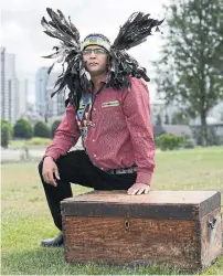  ?? JENNIFER GAUTHIER PHOTOS/STARMETRO VANCOUVER ?? Victor Harry (Xats’alanexw) at the former site of the Squamish nation village Senakw, with a box likely used to transport his family’s ceremonial mask and rattle safely out of Senakw.