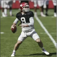 ?? (NWA Democrat-Gazette/Charlie Kaijo) ?? John Stephen Jones, shown during a scrimmage in Fayettevil­le last month, stood out in a quarterbac­k target practice game during spring workouts this week.