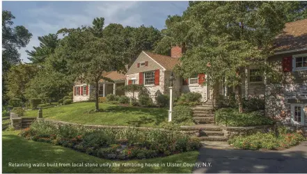  ??  ?? Retaining walls built from local stone unify the rambling house in Ulster County, N.Y.