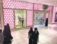  ??  ?? The Red Sea Mall in Jeddah, Saudi Arabia, has a Victoria’s Secret, but the mannequins are desexualiz­ed. Above, a lesson at the Saudi Driving School in Riyadh. The school has a waiting list of 70,000 and charges women six times as much as men for driving courses.