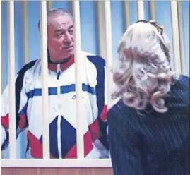  ?? [THE ASSOCIATED PRESS FILE PHOTO] ?? This was Sergei Skripal when he was behind bars in Moscow on Aug. 9, 2006. He was speaking to his lawyer.