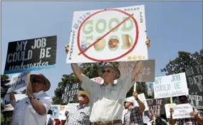  ?? RICH PEDRONCELL­I — THE ASSOCIATED PRESS ?? California farmers rally at the Capitol to protest a proposal by state water officials to increase water flows for the lower San Joaquin River to protect fish, at the Capitol, Monday, Aug. 20, 2018, in Sacramento, Calif. The State Water Resources Control Board is holding hearings this week concerning a plan to allow more water to flow freely down the Sacramento-San Joaquin River Delta from February to June, meaning less water will be available for farming and other needs.