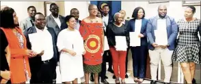  ?? ?? Eswatini Communicat­ions Commission Executive with the 14 entities representa­tives during the official handover of data protection certificat­es. The entities have successful­ly registered as Data Controller­s/Processors, in line with the Data Protection Act of 2022.
