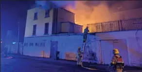  ?? ?? torched: Firefighte­rs try to put out blaze at the Shipwright pub in Ringsend
