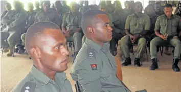  ?? Photo: Peni Komaisavai ?? Republic of Fiji Military Forces Lieutenant Peceli Nacolaival­u and 2nd Lieutenant Viliame Rigamoto look on during their farewell service at the Peacekeepi­ng Training headquarte­rs in Nadi on April 5, 2018.