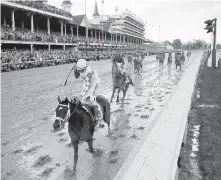  ??  ?? Always Dreaming and John Velazquez pass the finish line first in Saturday’s Kentucky Derby at Churchill Downs.