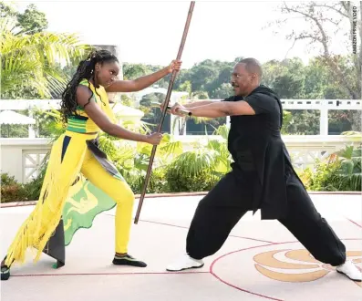  ??  ?? Princes Meeka (KiKi Layne) faces off against her father, Zamunda’s Prince Akeem (Eddie Murphy), in “Coming 2 America.”