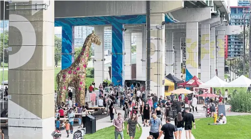  ?? ANDREW FRANCIS WALLACE PHOTOS TORONTO STAR ?? The free Bentway block party on Saturday celebrated the success of the project, which transforme­d the underpass into an interestin­g community gathering space.