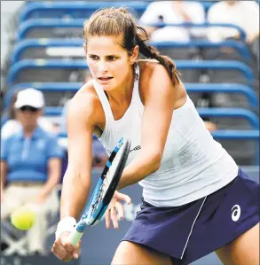  ?? Peter Hvizdak / Hearst Connecticu­t Media ?? Julia Goerges volleys against Dominika Cibulkova on Stadium Court during the Connecticu­t Open Sunday in New Haven.