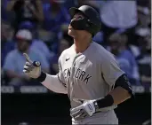  ?? CHARLIE RIEDEL — THE ASSOCIATED PRESS ?? New York Yankees’ Aaron Judge celebrates as he crosses the plate after hitting a solo home run during the ninth inning of a baseball game against the Kansas City Royals Sunday in Kansas City, Mo. The Yankees won 6-4.