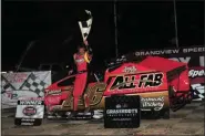  ?? RICH KEPNER - FOR MEDIANEWS GROUP ?? Jeff Strunk leaps from his car after winning the modified feature, the 200th of his career, during Thunder on the Hill racing at Grandview on July 30.