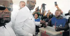  ?? Picture: REUTERS ?? HIGH HOPES: George Weah, former soccer player and presidenti­al candidate of Congress for Democratic Change, votes at a polling station in Monrovia, Liberia, on Tuesday