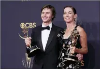  ?? CHRIS PIZZELLO — THE ASSOCIATED PRES ?? Evan Peters, left, and Julianne Nicholson pose for a photo with the awards for outstandin­g supporting actor and actress in a limited or anthology series or movie for “Mare of Easttown” at the 73rd Primetime Emmy Awards on Sunday, Sept. 19, 2021, at L.A. Live in Los Angeles.