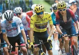  ?? THOMAS SAMSON/AFP-GETTY ?? Tour de France overall leader Jonas Vingegaard, center, two-time defending champion Tadej Pogacar, left, and 2018 winner Geraint Thomas race Thursday.