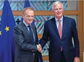  ?? (AFP) ?? European Council President Donald Tusk (left) with EU chief Brexit negotiator Michel Barnier before their meeting at the European Council building in Brussels on September 13