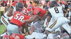  ?? Curtis Compton /
Atlanta Journal-Constituti­on via AP ?? Georgia running back Nick Chubb (27) goes over the top into the end zone against Appalachia­n State during Saturday’s game.