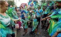  ??  ?? Performers take part in the Notting Hill Carnival.