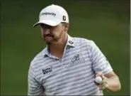  ?? TONY DEJAK — THE ASSOCIATED PRESS ?? Jimmy Walker acknowledg­es the gallery after finishing the second round of the Bridgeston­e Invitation­al. J. Walker T. Pieters Z. Johnson R. McIlroy H. Matsuyama 67-67—136