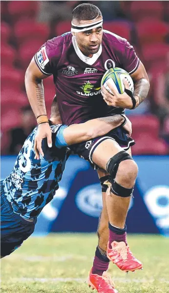  ?? Picture: GETTY IMAGES ?? Reds tryscorer Lukhan Salakaia-Loto takes on the Bulls defence